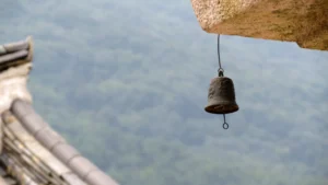 a solitary temple bell in the mountains, representing the sound of primordial Aum - yoga theory